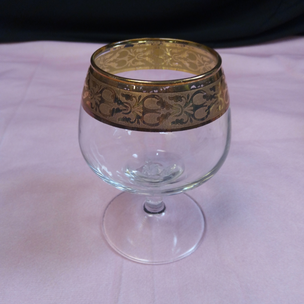Elegant Gold Rimmed Glass Goblet.